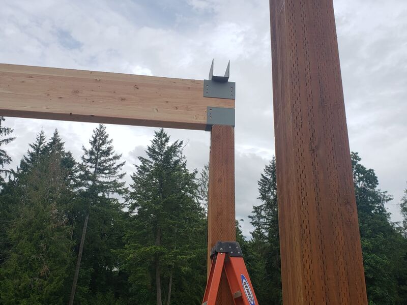 Roof ridge framing on home addition by ArchAngel Construction Services