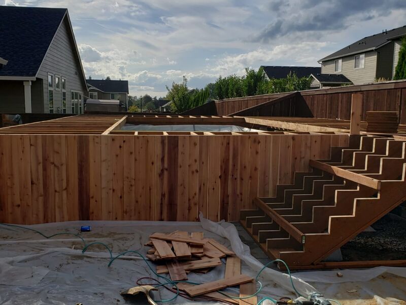 Cedar deck and stair framing addition, backyard by ArchAngel Construction Services