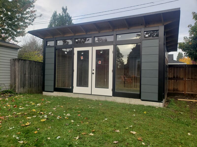 Completed tan studio shed with French doors by ArchAngel Construction Services