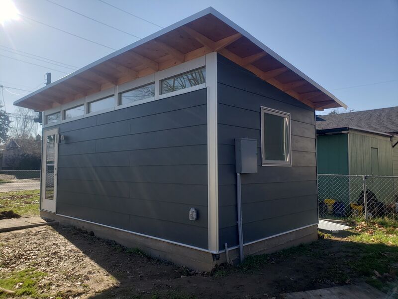 Studio shed structural framing with sheathing by ArchAngel Construction Services