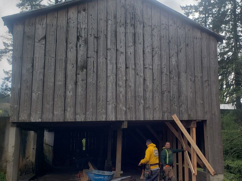 Historic barn foundation post repair by ArchAngel Construction Services