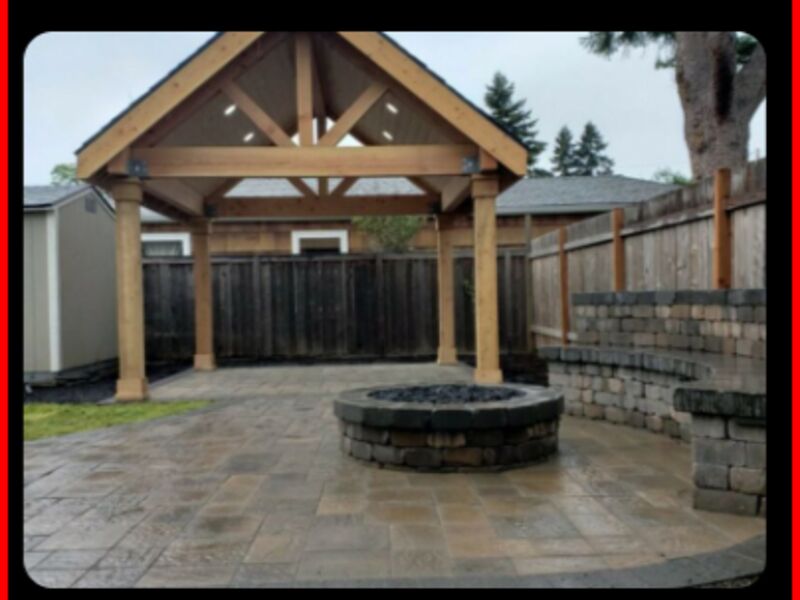 Patio cover with fire pit and stamped concrete patio by ArchAngel Construction Services