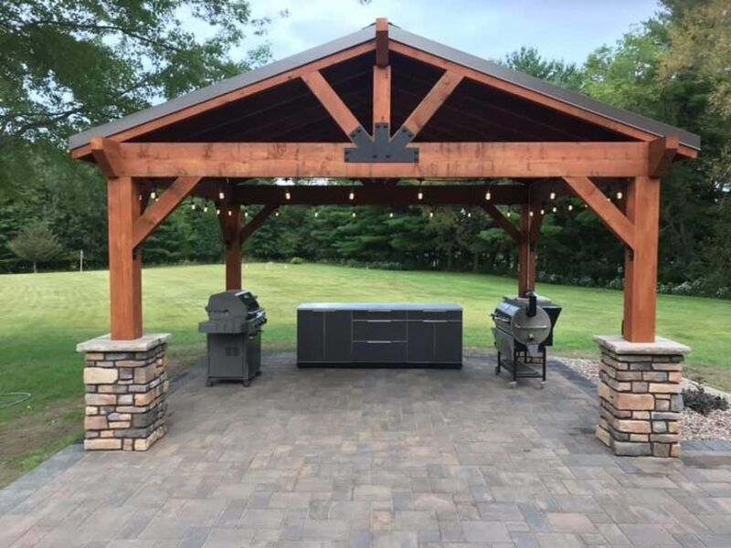 Freestanding wood pavilion with outdoor kitchen by ArchAngel Construction Services